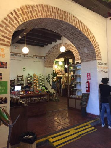 a man standing in a grocery store with an archway at Best place in Plaza Mayor Lima, Pizarro building in Lima