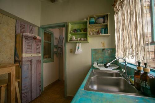 a kitchen with a sink and a counter top at Precioso Departamento in Morelia