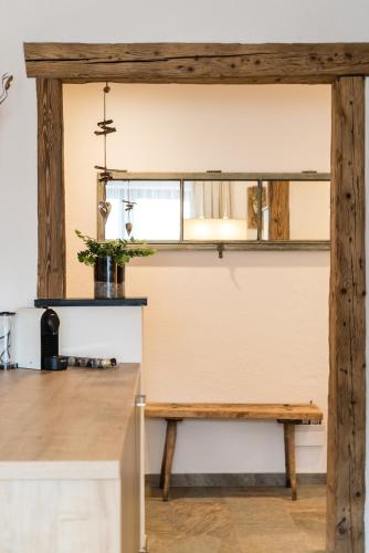 a kitchen with a wooden counter and a table at Appartement Wiederkehr in Flachau