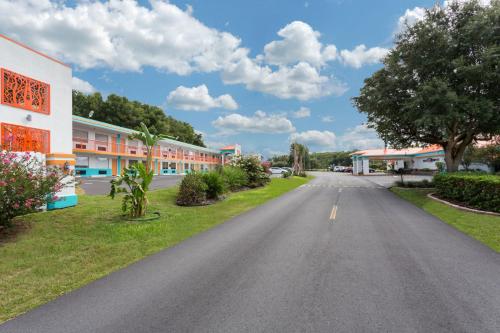 an empty road in front of a building at Howard Johnson by Wyndham Ocala FL I-75 in Ocala