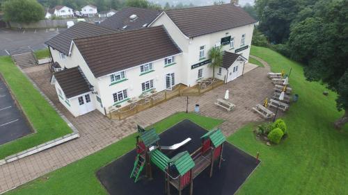 an aerial view of a large white house at Brewers Lodge in Blackwood