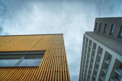 two tall buildings next to each other at Hotel Atom Třebíč in Třebíč