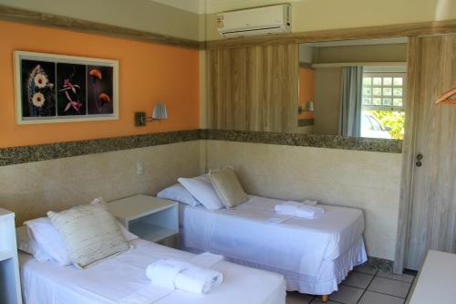Postel nebo postele na pokoji v ubytování Hotel Pousada da Mangueira