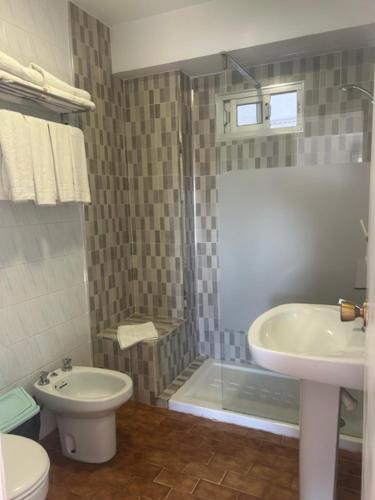 a bathroom with a sink and a toilet and a shower at Hostal Puerto Beach in Motril
