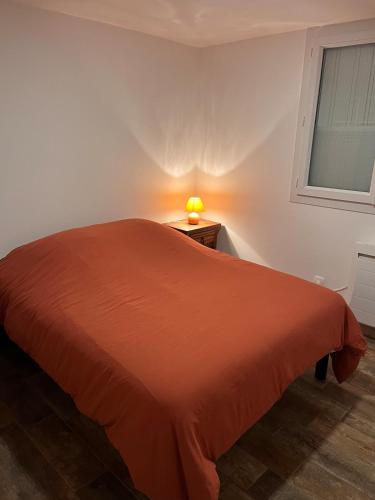 Llit o llits en una habitació de L'escapade