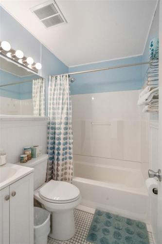 a bathroom with a white toilet and a shower at 6701 Atlantic Ave, Unit 301 in Wildwood Crest