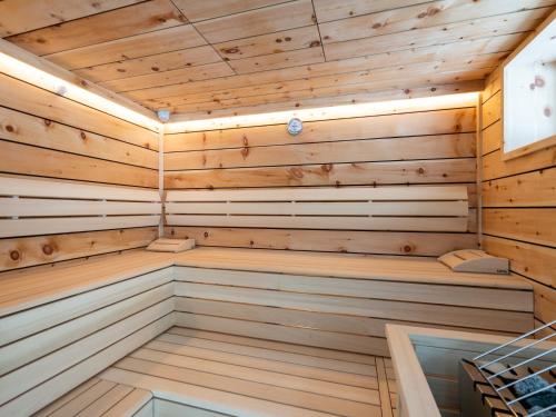 a sauna with wooden walls and ceilings at Luxury Chalet in Saalbach-Hinterglemm with Sauna in Saalbach-Hinterglemm