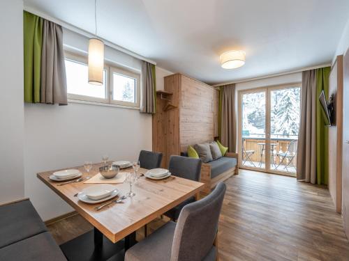a dining room with a table and chairs at Luxury Chalet in Saalbach-Hinterglemm with Sauna in Saalbach-Hinterglemm