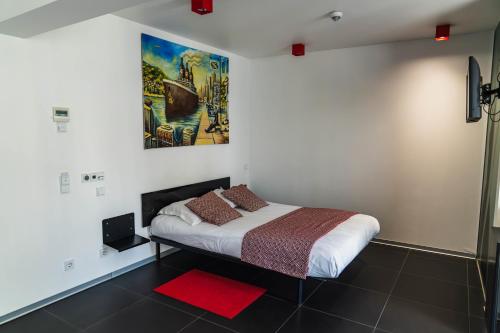 Llit o llits en una habitació de Hotel Grey