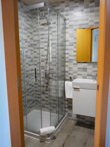 a bathroom with a shower and a sink at L'Hostalet d'Arenys de Mar in Arenys de Mar