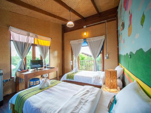Postel nebo postele na pokoji v ubytování Baan Chokdee Pai Resort