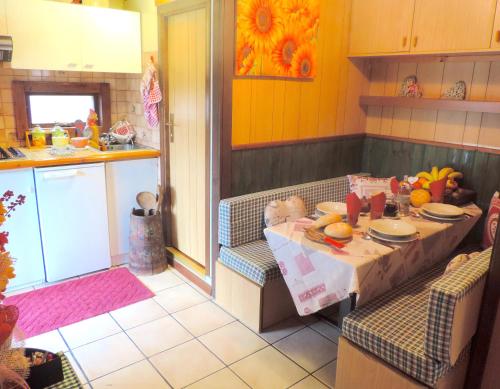 a kitchen with a table with food on it at Villaggio Turistico Camping Cervino in Antey-Saint-André