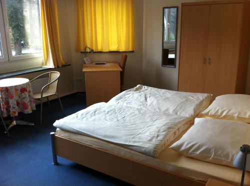 Postel nebo postele na pokoji v ubytování Hotel Appart