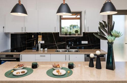 a kitchen with two plates of food on a table at Villa Elea with Private Pool in Zakynthos
