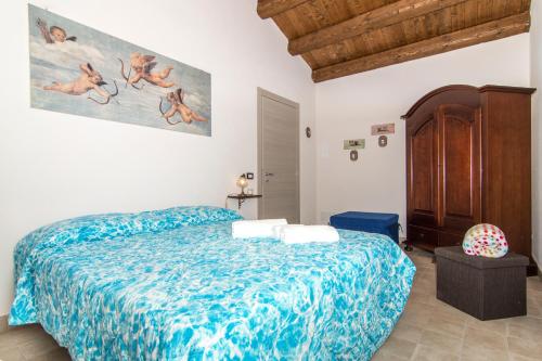 En eller flere senge i et værelse på Abbraccio del Carrubo