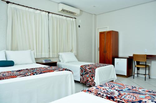 Säng eller sängar i ett rum på Lago Da Palma