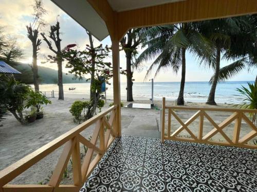 a porch with a view of the beach at Samudra Beach Chalet in Perhentian Islands