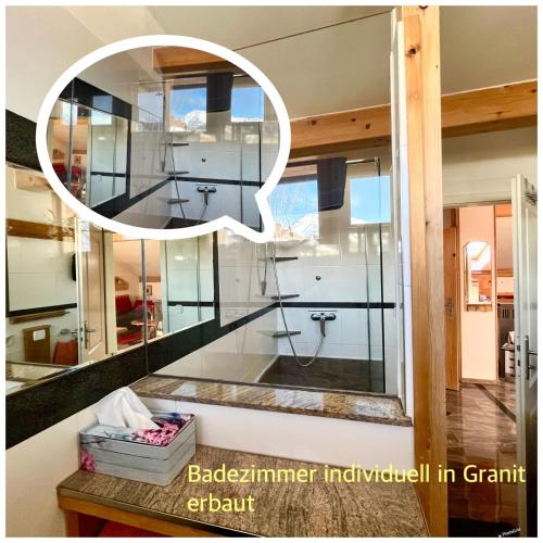 a bathroom in a house with a window at Chalet Magda-Lena in Heiligenblut
