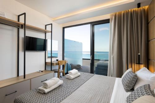 Vuode tai vuoteita majoituspaikassa Poseidon Hotel