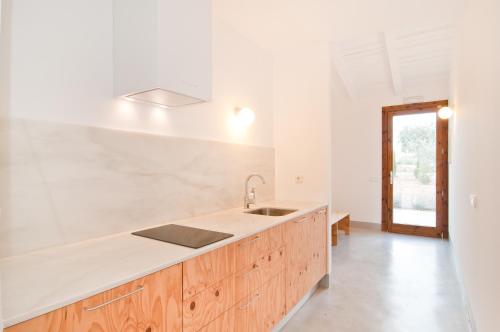 a kitchen with a sink and a counter top at Sa Nau Agroturismo - Adults Only over 16 in Portocolom