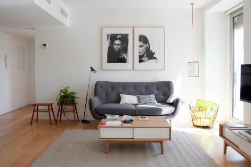 a living room with a couch and a coffee table at 60 Balconies Art in Madrid