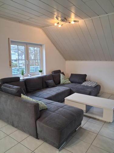 a living room with a couch and a table at Ferienwohnung Stefanie OG in Bad Breisig