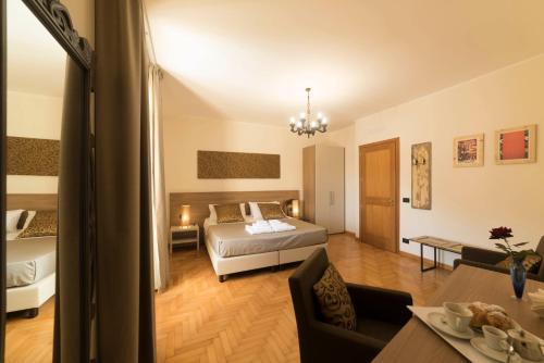 a bedroom with a bed and a living room at BBuSS Country Club in Catanzaro