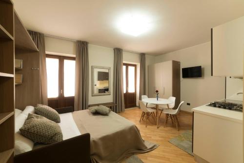 a bedroom with a bed and a table in a room at BBuSS Country Club in Catanzaro