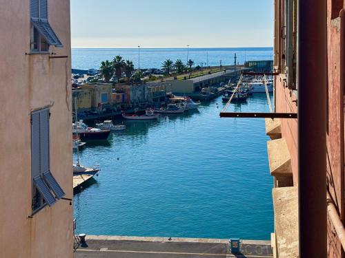 a view of a harbor with boats in the water at Tra i gussi in Imperia