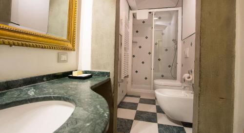a bathroom with a sink and a toilet at Villa Il Fedino in San Casciano in Val di Pesa