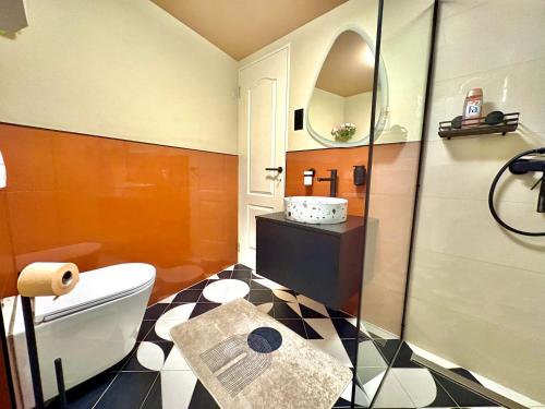 a bathroom with a toilet and a sink at Buda's Hidden Heaven 1 with Private Sauna in Budapest