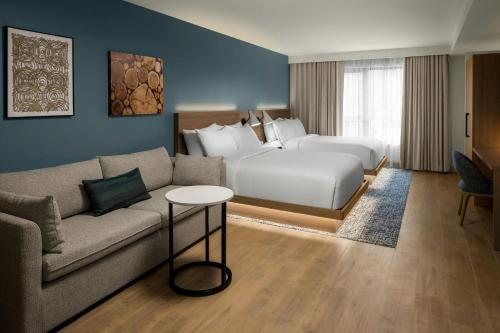 a hotel room with a bed and a couch at Element by Marriott Seattle Downtown in Seattle