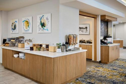 a kitchen with a counter and a counter top at TownePlace Suites by Marriott Ottawa Kanata in Ottawa