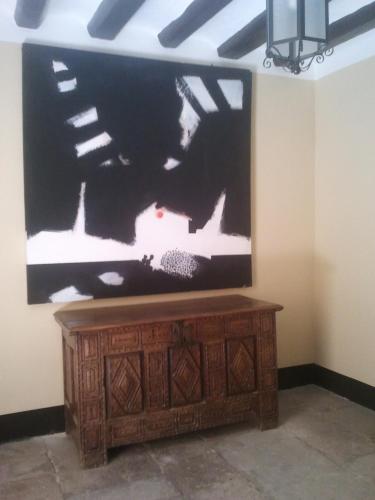 a flat screen tv sitting on top of a wooden entertainment center at Casa de Landa in Dicastillo