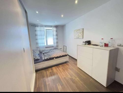 a room with a bed and a window in it at Apartmán PP Tatry in Jezersko
