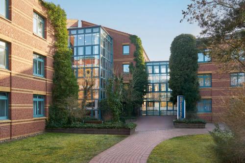 an exterior view of a brick building at Four Points Flex by Sheraton Hannover in Hannover