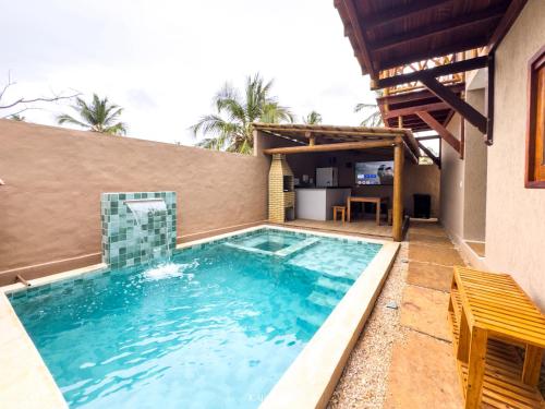 a swimming pool in the backyard of a house at Icaraizinho House in Icaraí