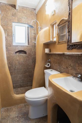 a bathroom with a toilet and a sink at Liva Mare - Serifos in Livadakia