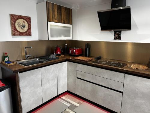 a kitchen with a sink and a counter top at Sealladh Sona in Inverness