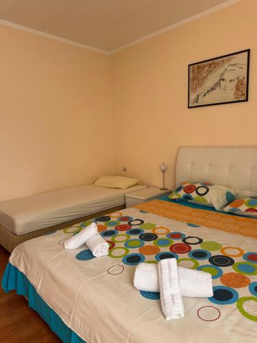 Postel nebo postele na pokoji v ubytování Apartmani VV