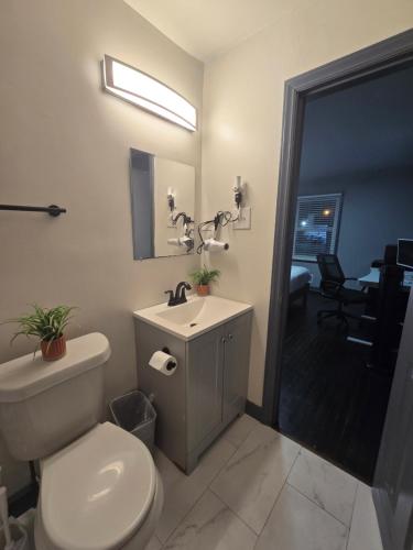 a bathroom with a white toilet and a sink at Cozy MasterRoom Gresham Park in Atlanta