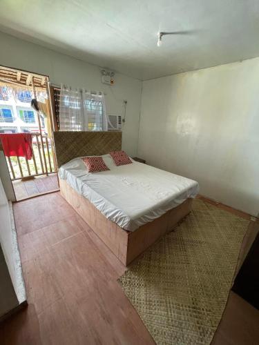 a bedroom with a bed in a room at Nana's House in San Isidro