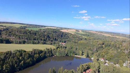 an aerial view of a lake in the countryside at Chata Seč II in Bojanow