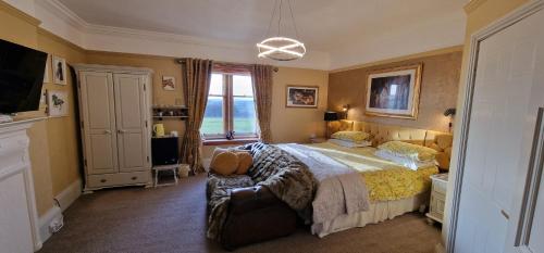 a bedroom with a large bed and a window at Hay Farm House in Ford