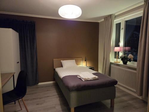 a bedroom with a bed and a window at RåneVillan in Råneå