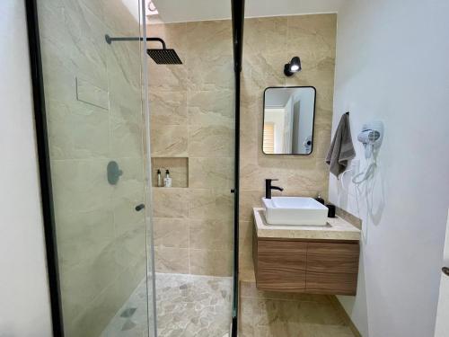 a bathroom with a shower and a sink at Casa Boho - Heated Pool, Private Grill & Garden - Xochitepec in Tezoyuca