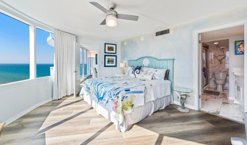 a bedroom with a bed and a view of the ocean at Escape 2 The Beach Daytona Beach FL 2BR 2B as seen on Youtube in Daytona Beach Shores