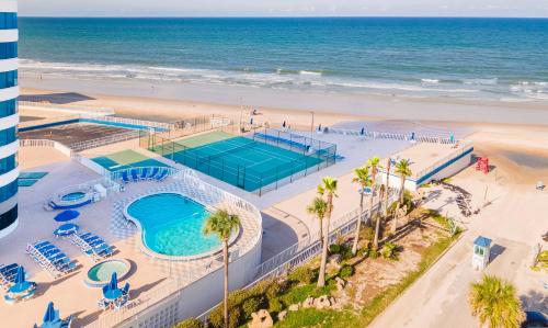 an overhead view of a pool and the beach at Escape 2 The Beach Daytona Beach FL 2BR 2B as seen on Youtube in Daytona Beach Shores