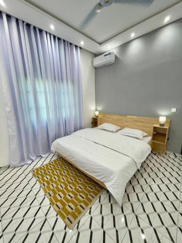 En eller flere senge i et værelse på Solena Suites