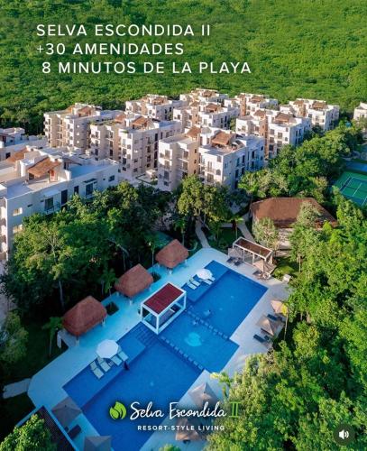 an aerial view of a resort with a swimming pool at Resort living Selva Escondida II in Puerto Morelos
